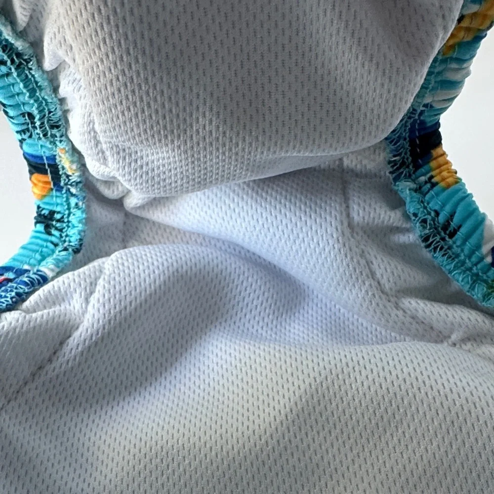 i play. Blue Surfboard and Palm Tree Swim Diaper